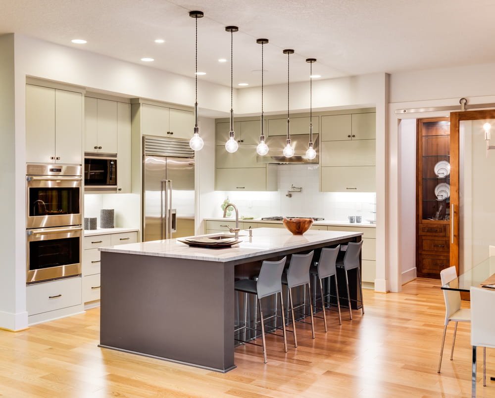A well lit kitchen area in an upmarket home